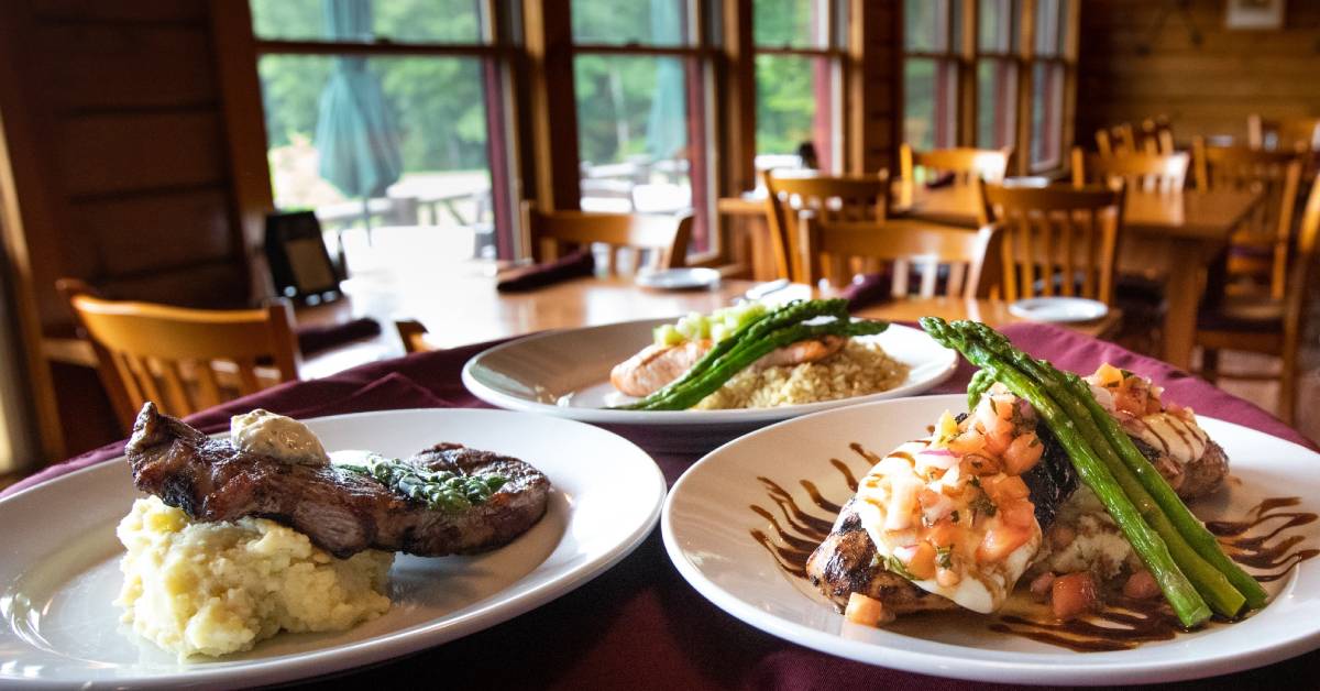 three plates of food with meat and potatoes and asparagus