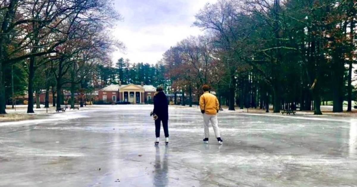 two people on an outdoor ice skating rink