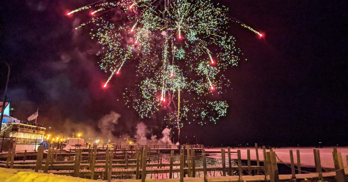 fireworks over a lake in winter