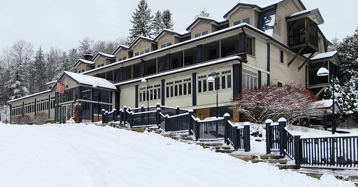 exterior of friends lake inn in the winter