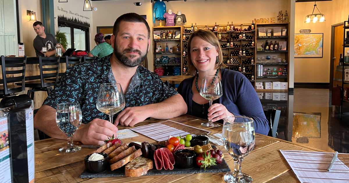 man and woman at a wine dinner