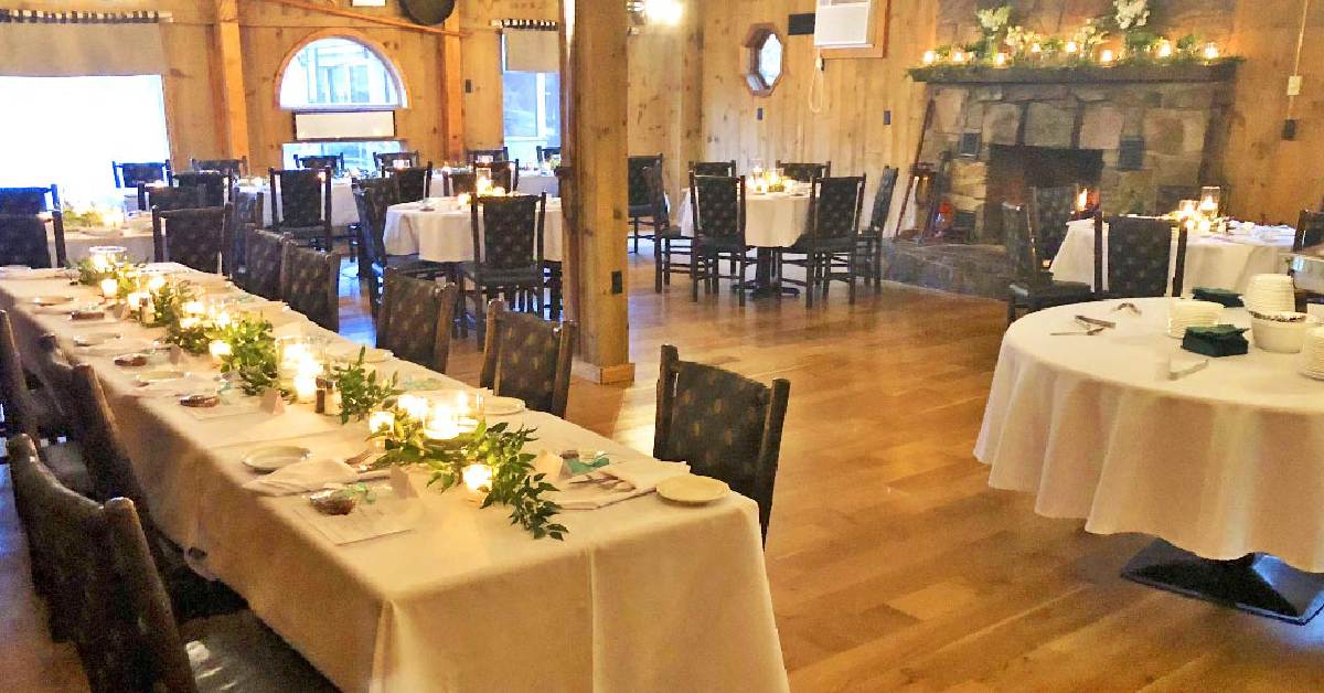 dining room with tables and a fireplace