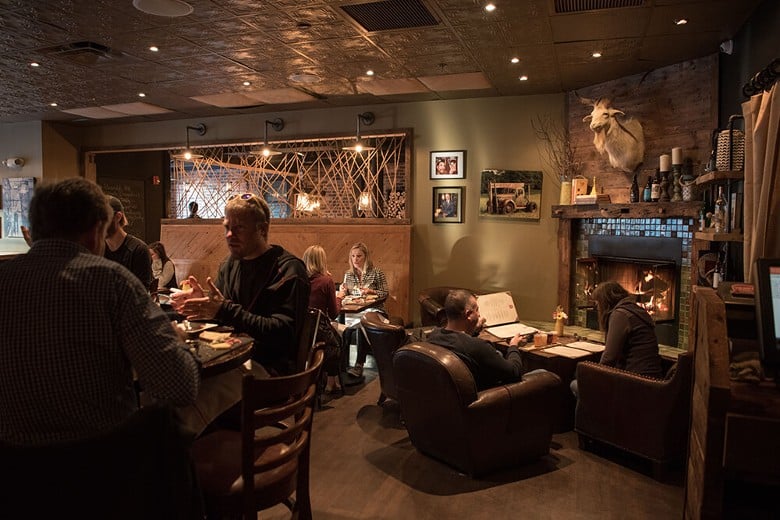 people seated inside a rustic looking taproom