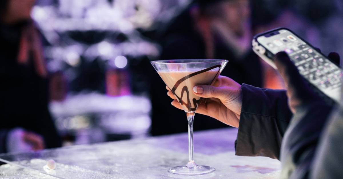 hand holding chocolate martini at ice bar