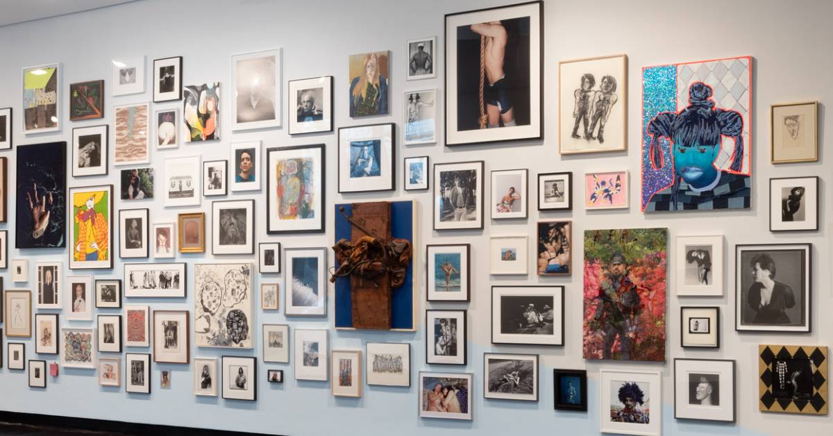 many paintings on a wall