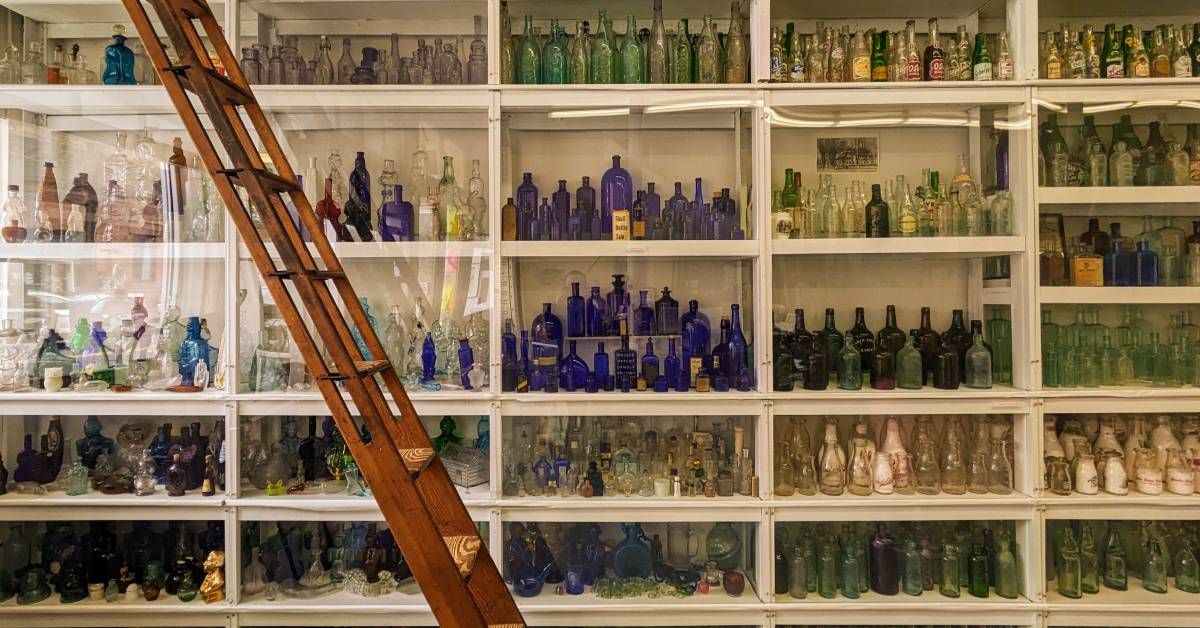 shelves of bottles at bottle museum