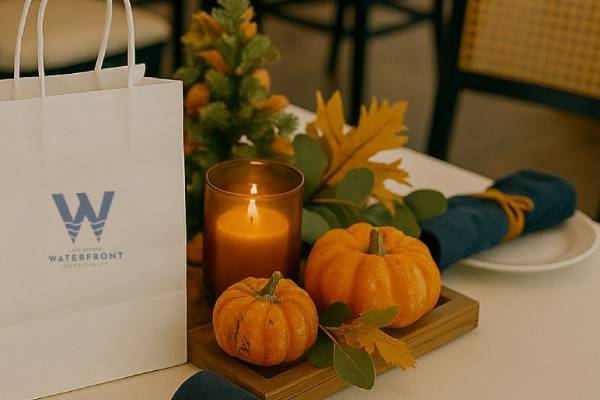 table set with pumpkins and candle