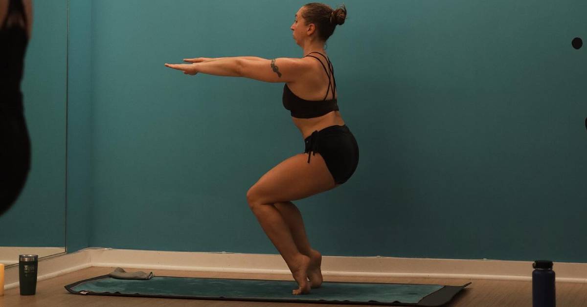 woman in flying chair pose