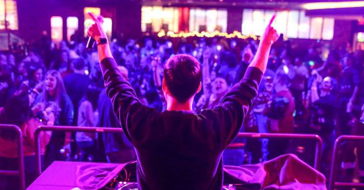 purple lights shining in a night club