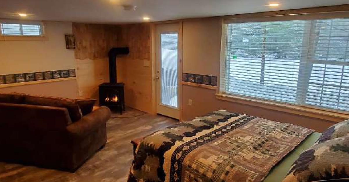 rustic lodging area with a fireplace