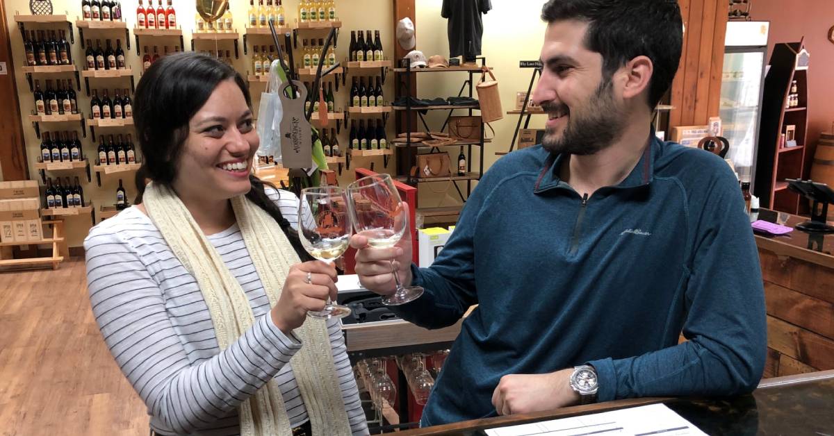 two people enjoying a wine tasting at adirondack winery
