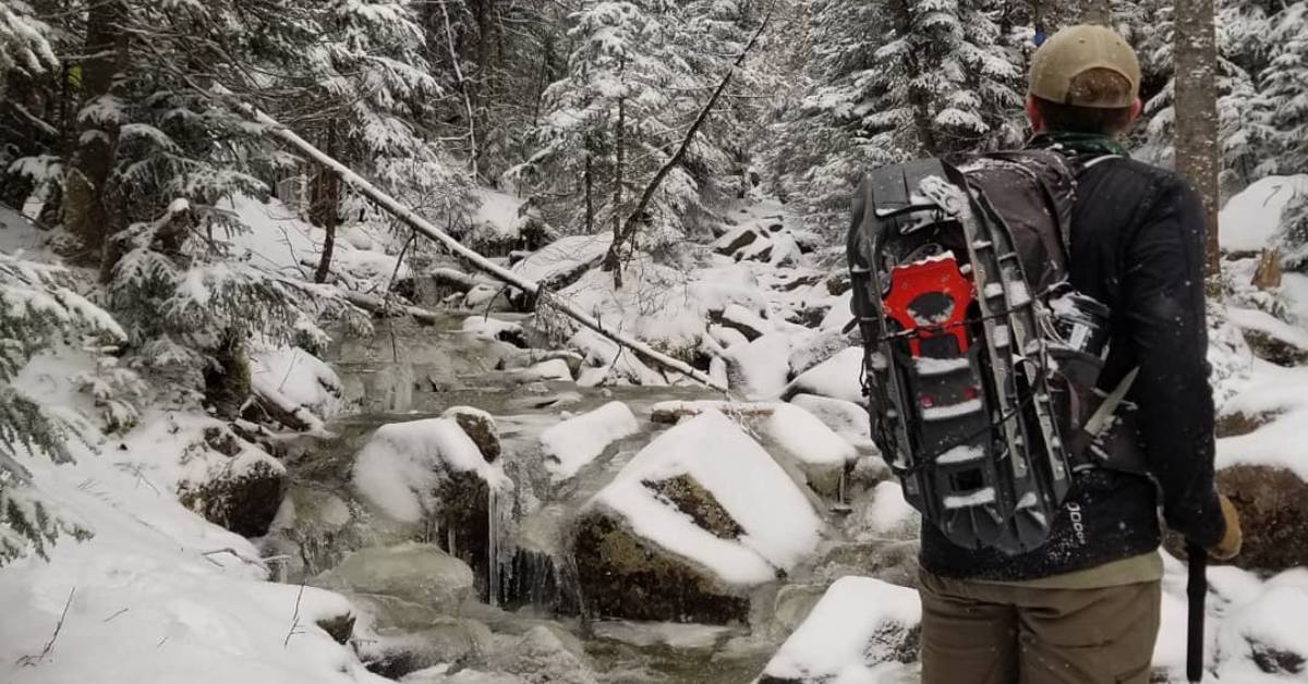 man hiking in winter