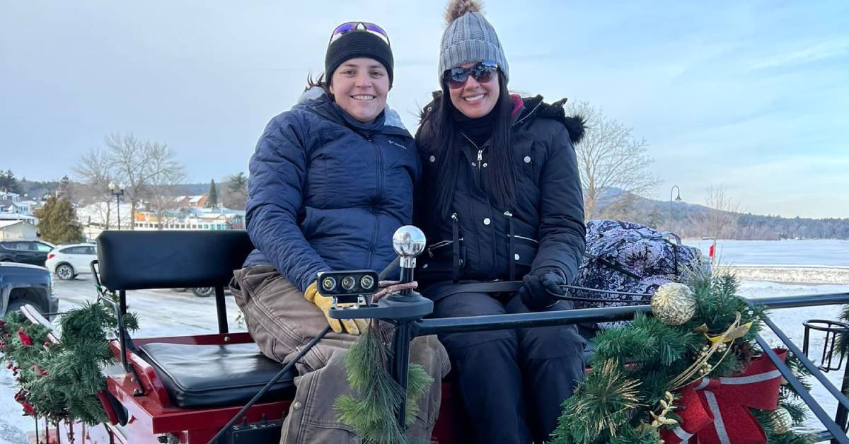 two people on horse-drawn carriage ride