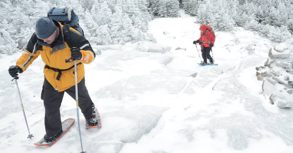 people snowshoeing up a mountain
