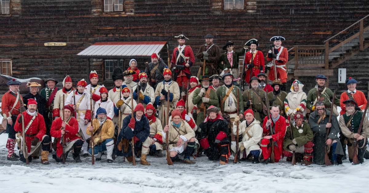 group of reenactors in winter outside historic fort