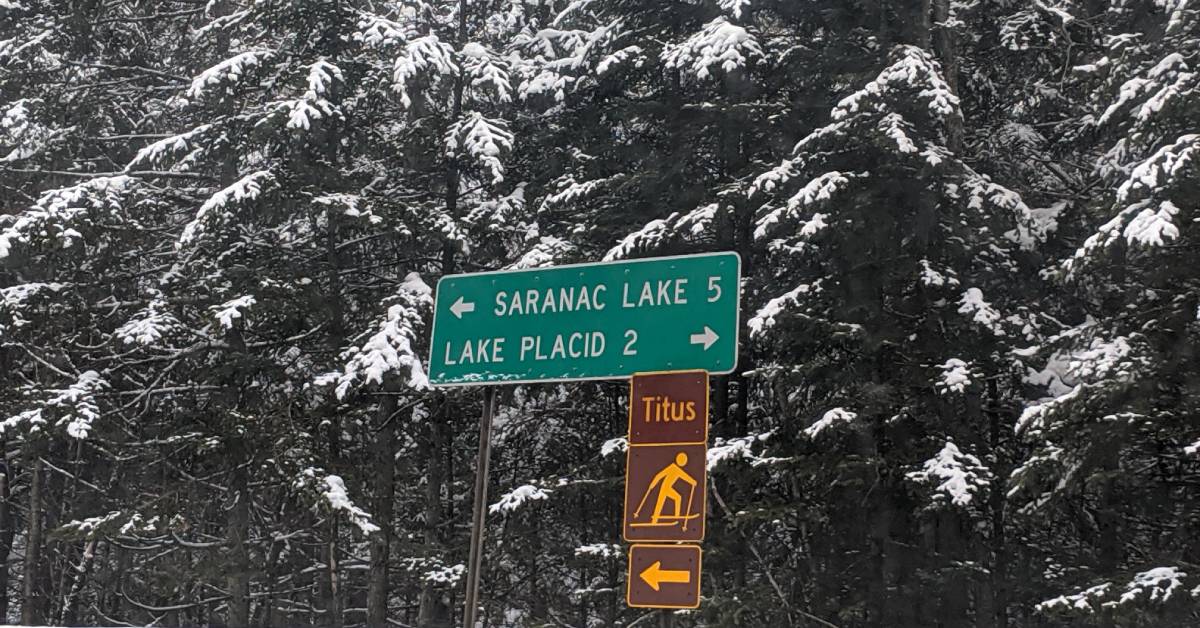 sign in winter for saranac lake and lake placid