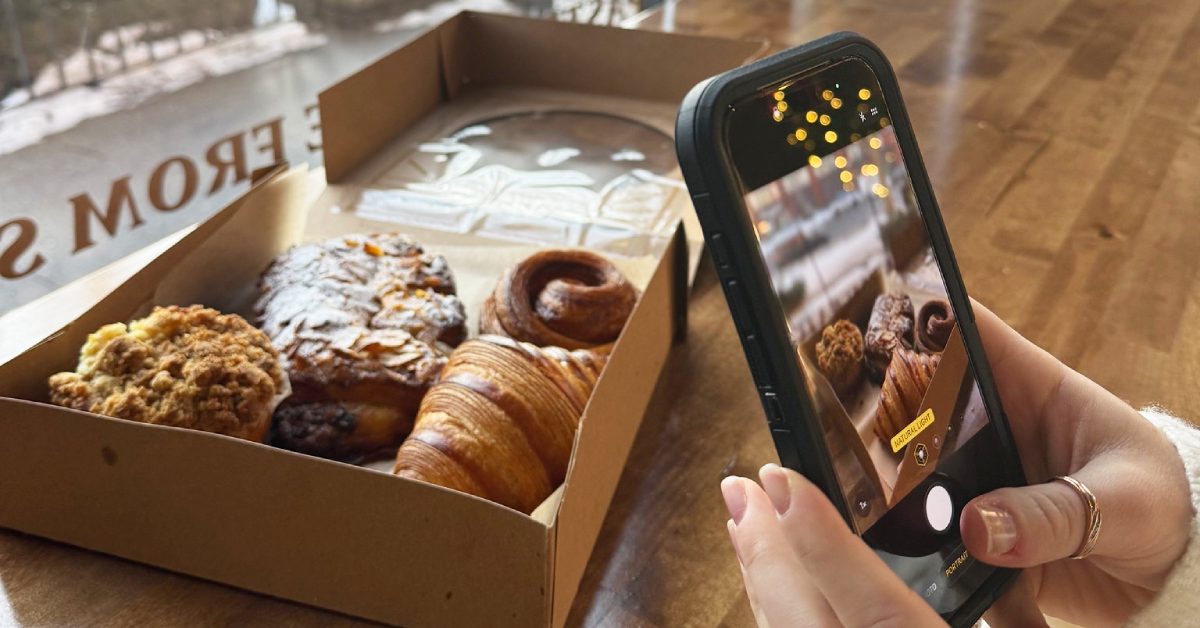 person taking photo of baked goods