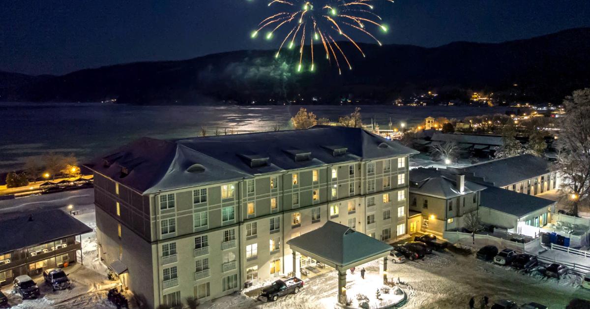 exterior of Fort William Henry Hotel in winter with fireworks