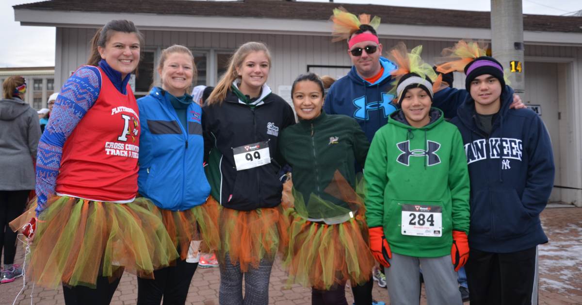 group of people dressed up for a turkey trot race