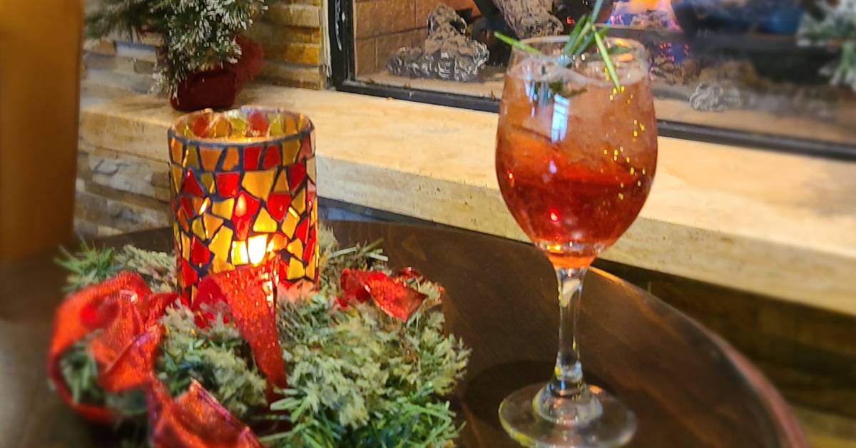 festive drink by festive table centerpiece