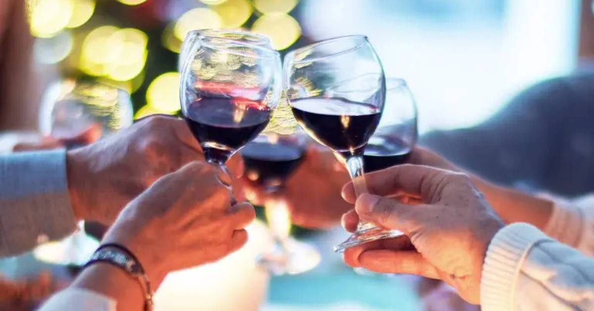 four glasses of red wine cheers