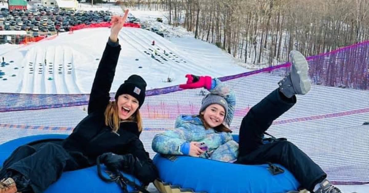 mom and daughter about to snow tube