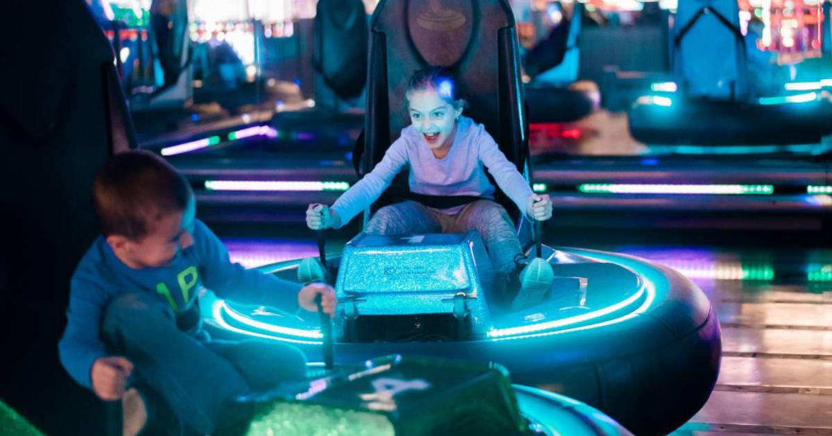 boy and girl in bumper cars