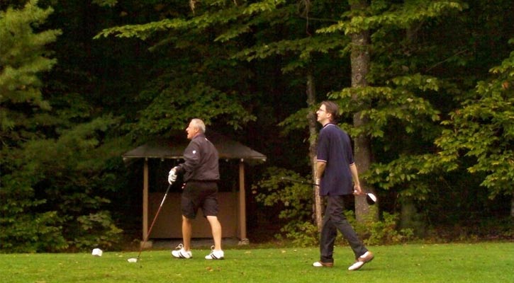 two men on a golf course