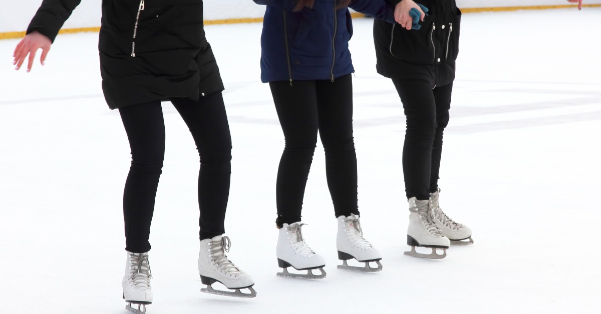 three women ice skating