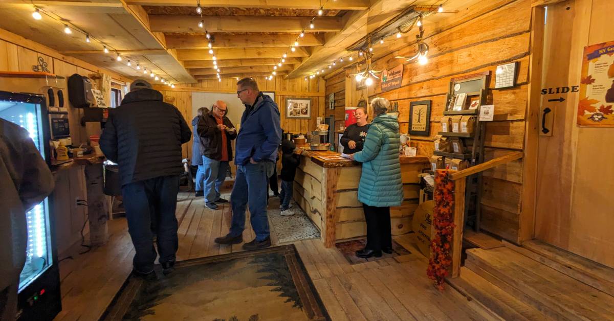 people at maple farm inside store