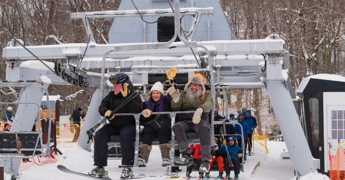 people seated on a ski lift