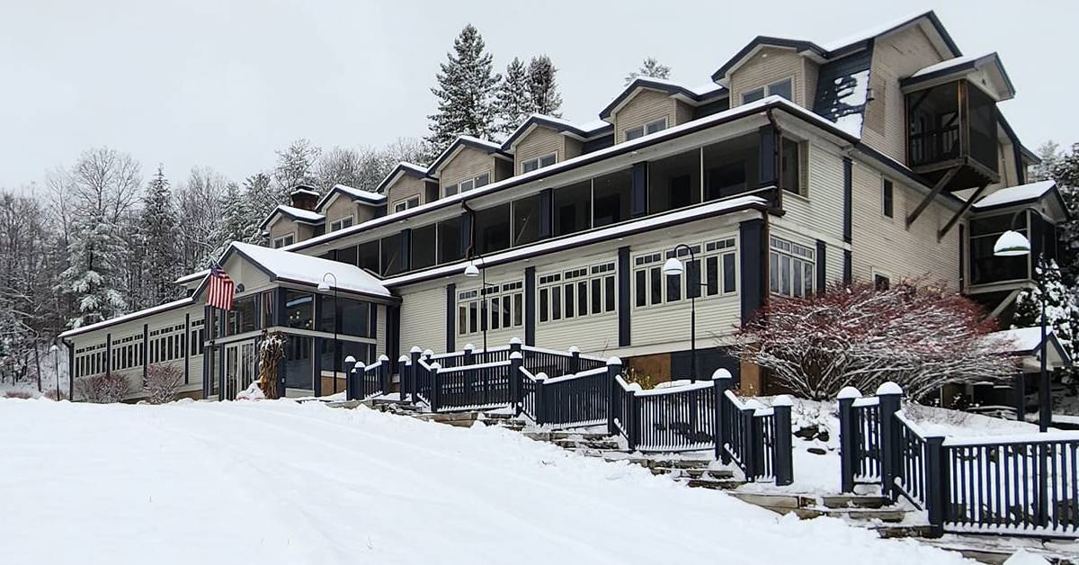 exterior of friends lake inn in the winter