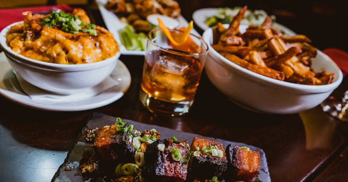 bourbon glass next to appetizers