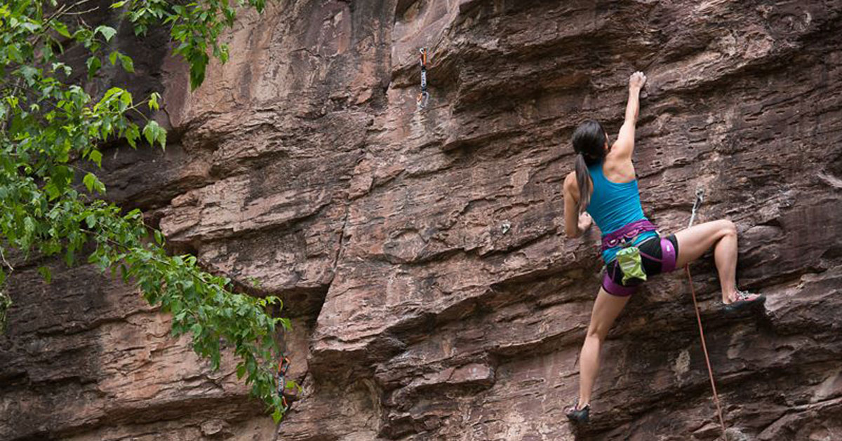 woman rock climbing