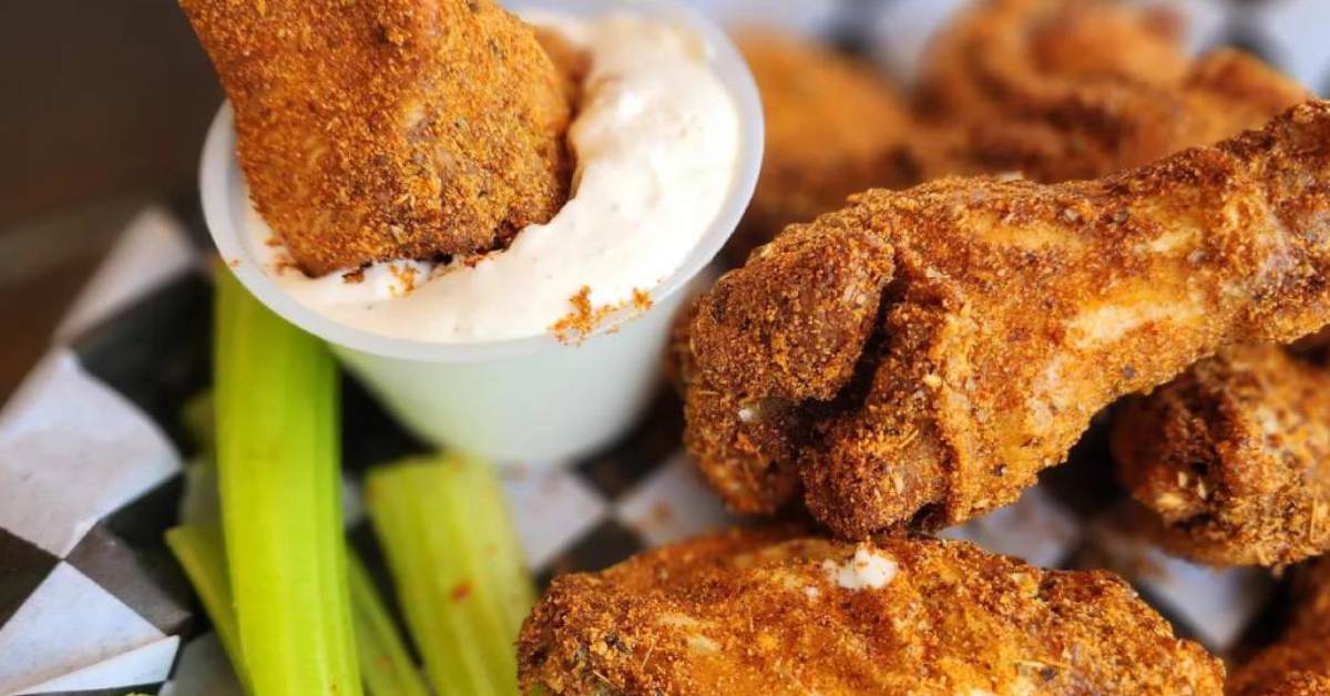 chicken wings with seasoning and dip and celery