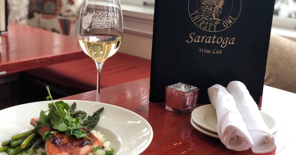 A glass of wine paired with one of Thirst Owl Bistros' dishes