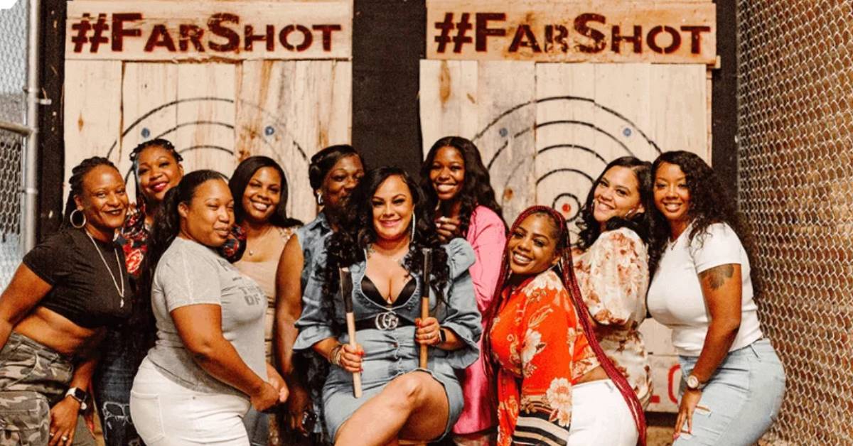 Group of women smiling for a picture at Far Shot Axe Throwing