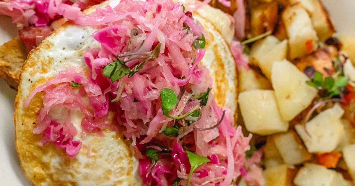 eggs, potatoes, red cabbage, and more in a brunch special