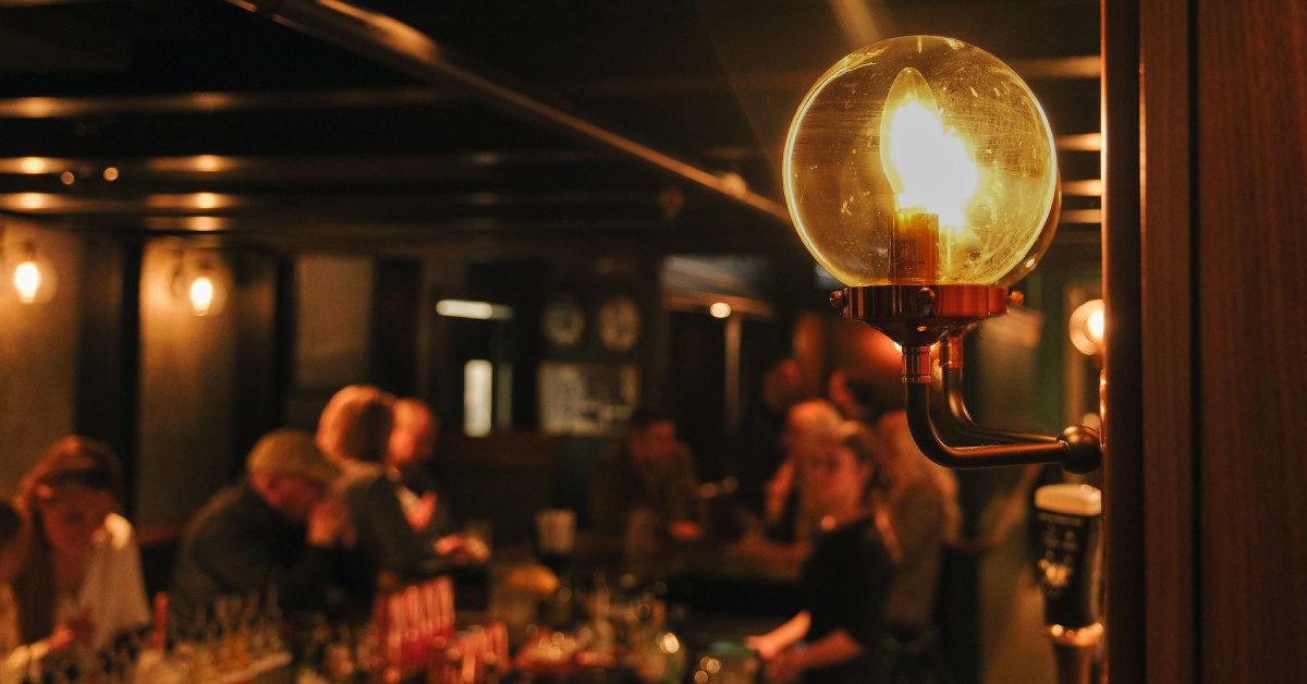 inside of a restaurant with a speakeasy lighting and vibe