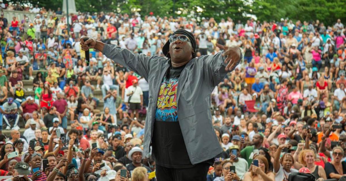 performer on stage at outdoor concert