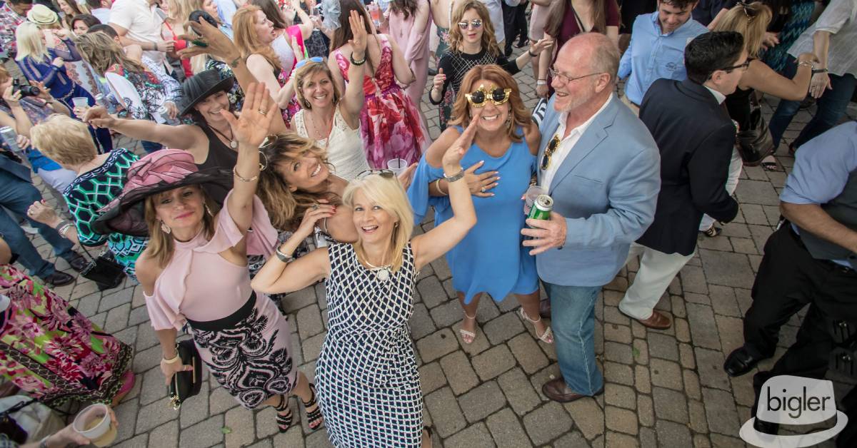 people dressed up for a kentucky derby watch party