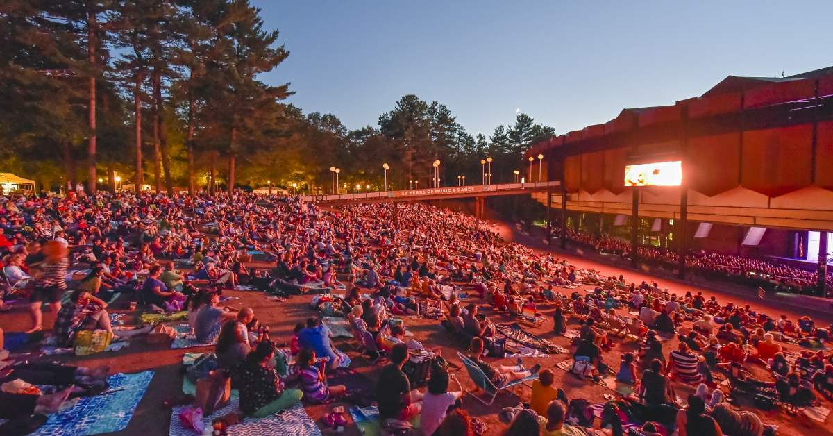people at concert venue in the evening