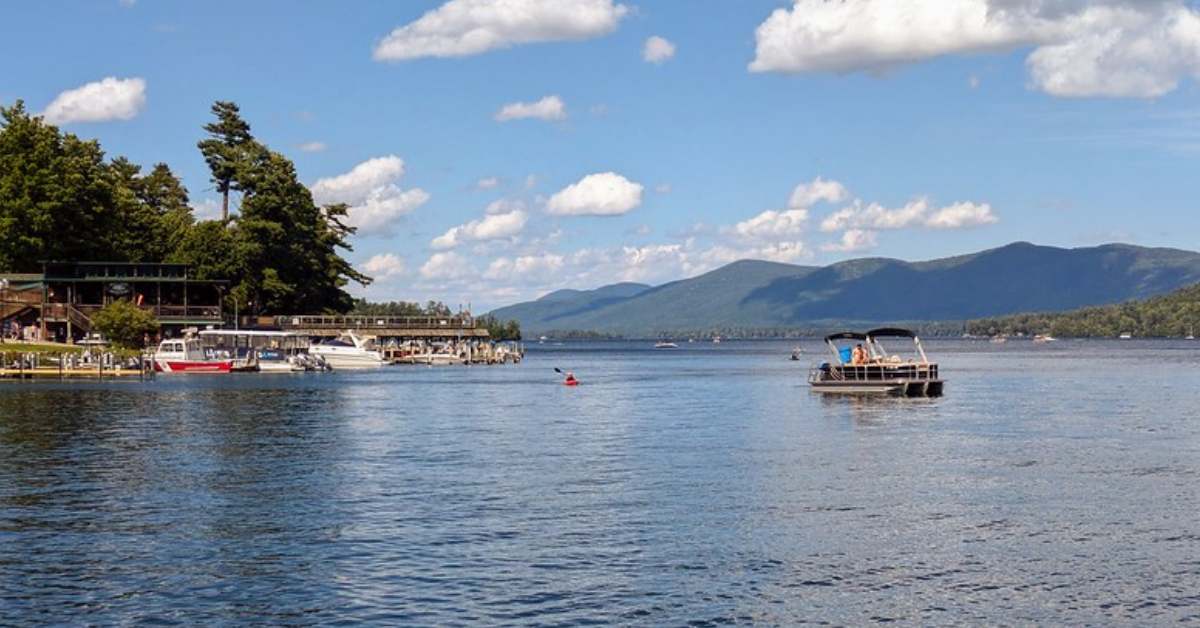 a boat out on lake george on a sunny day