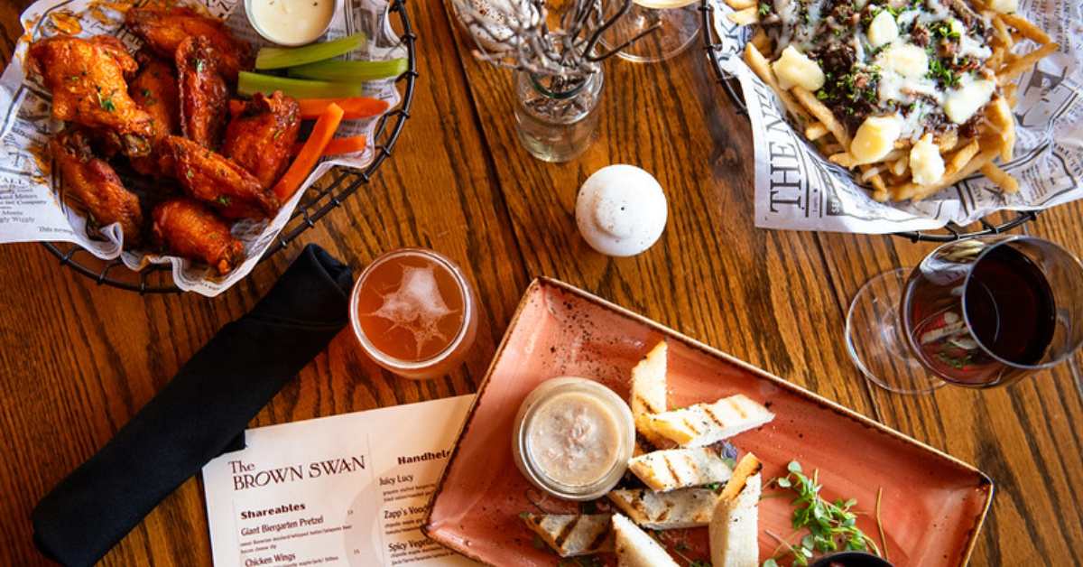 top down view of a menu and food on plates