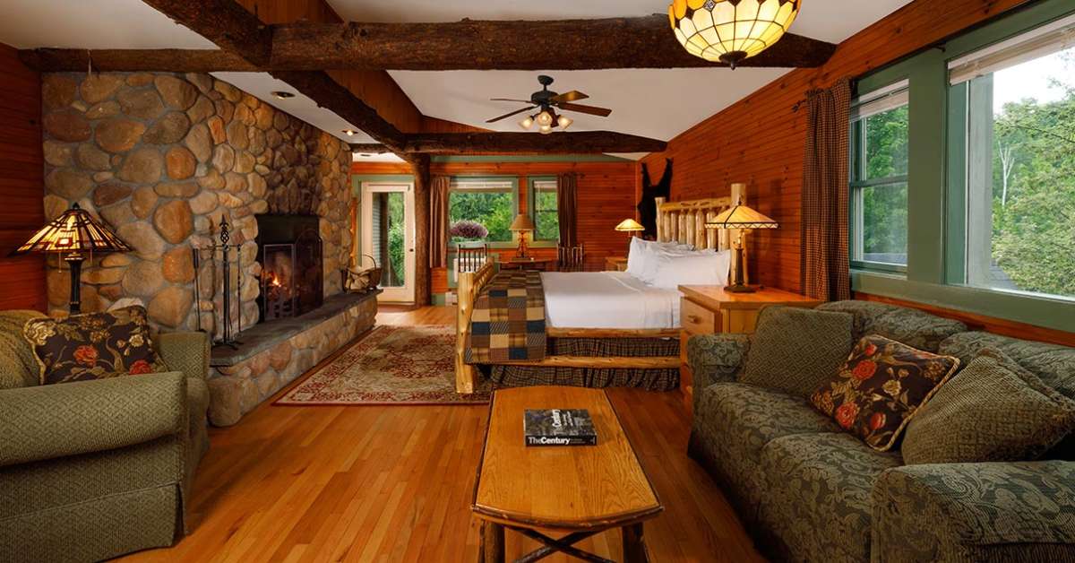 a large rustic suite with living area and bed
