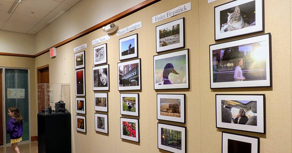 photographs on wall in folklife center of crandall public library