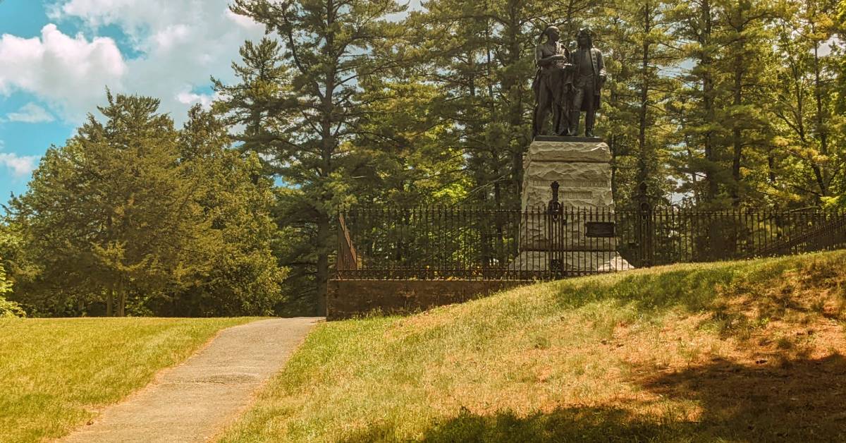 monuments in lake george battlefield state park next to walking path