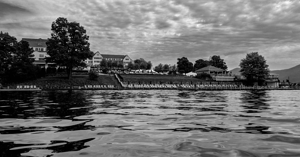 black and white photo of sagamore resort, view from the water