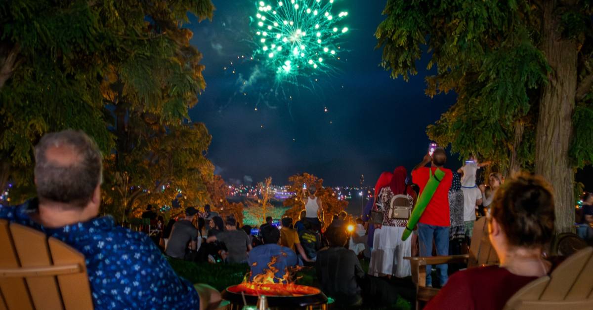 people at fort william henry watching fireworks