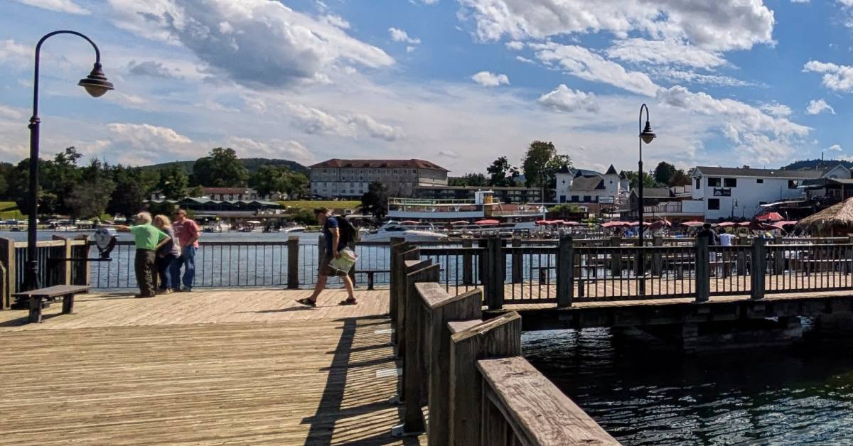 people on dock in lake george